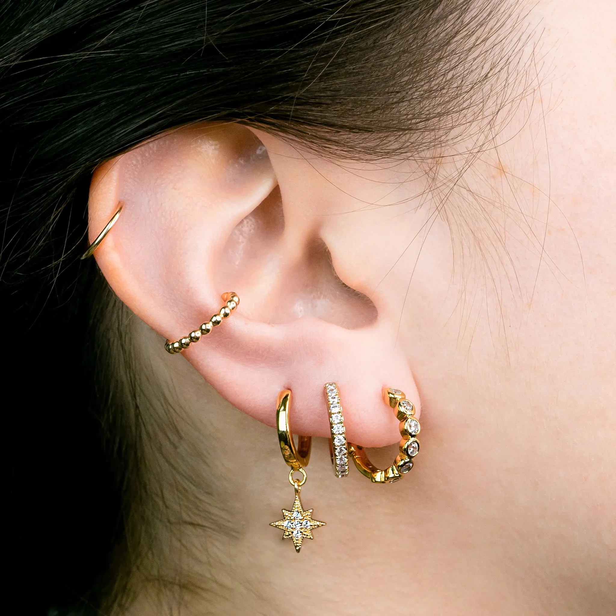 Twinkling Pavé Star Huggie Earrings